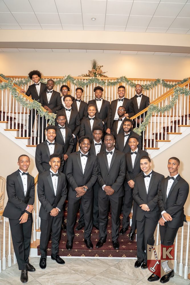 Beaux of the Beautillion Leadership Academy gathered together in tuxedos, Class of 2019